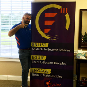 man standing with custom retractable banner