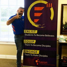 Man standing with custom retractable banner