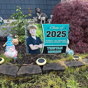 graduation sign in garden