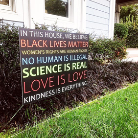 sign set up next to a house