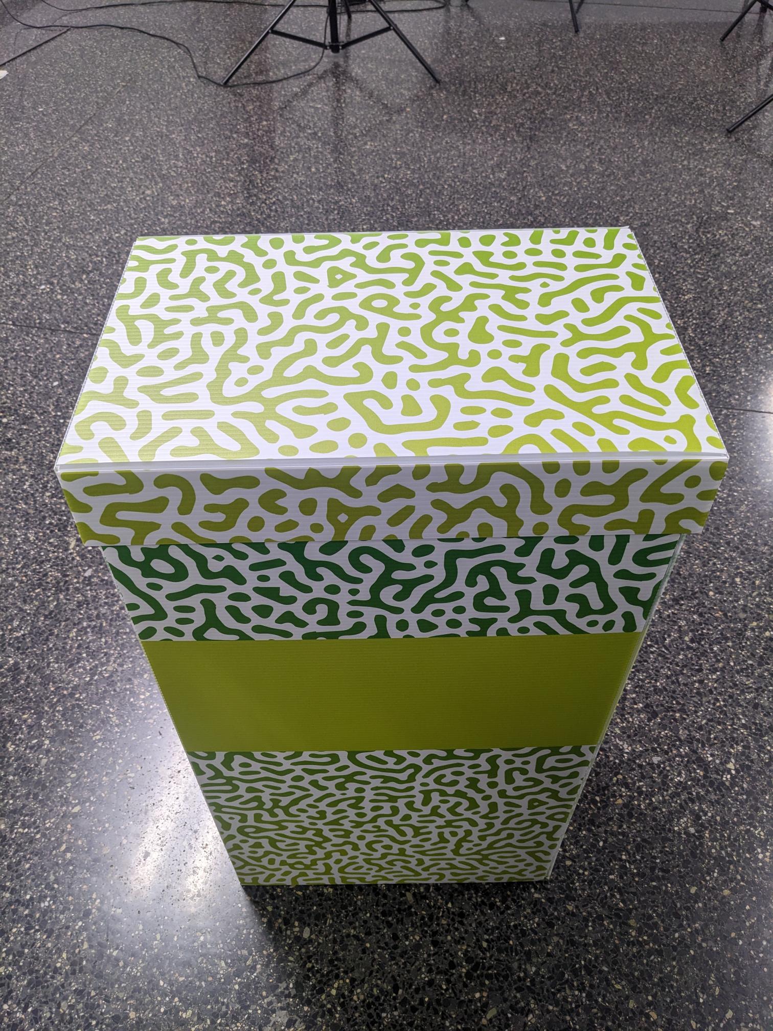 cardboard trash can with closed lid, no hole